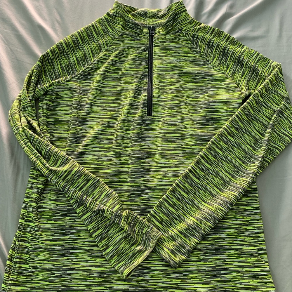 a green white and grey zip up sweatshirt